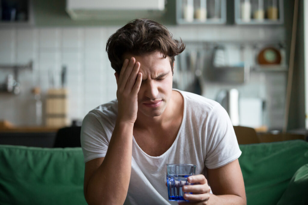 Young man suffering from alcohol withdrawal