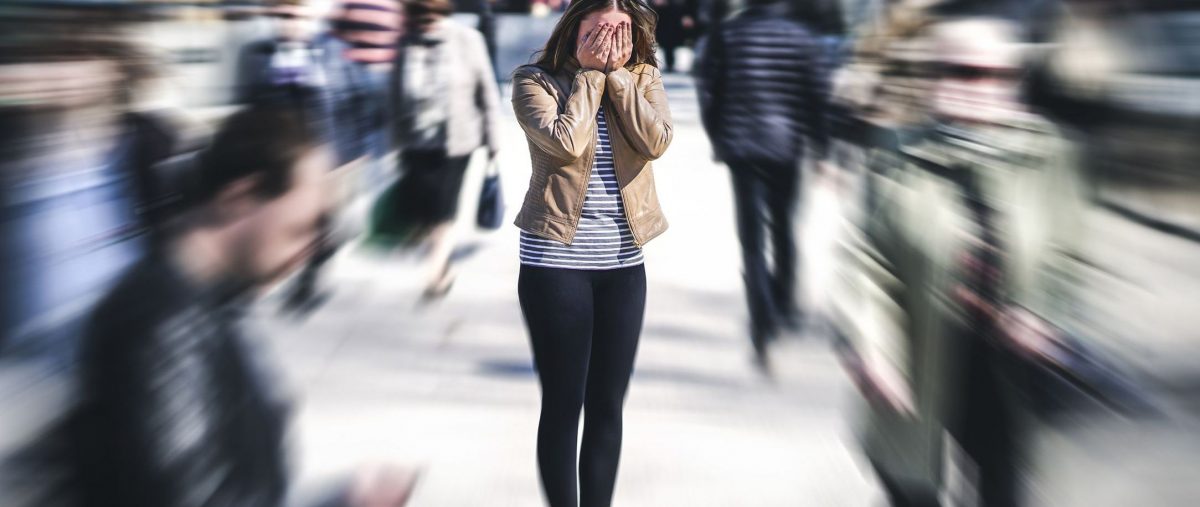 woman in a crowded area panicking